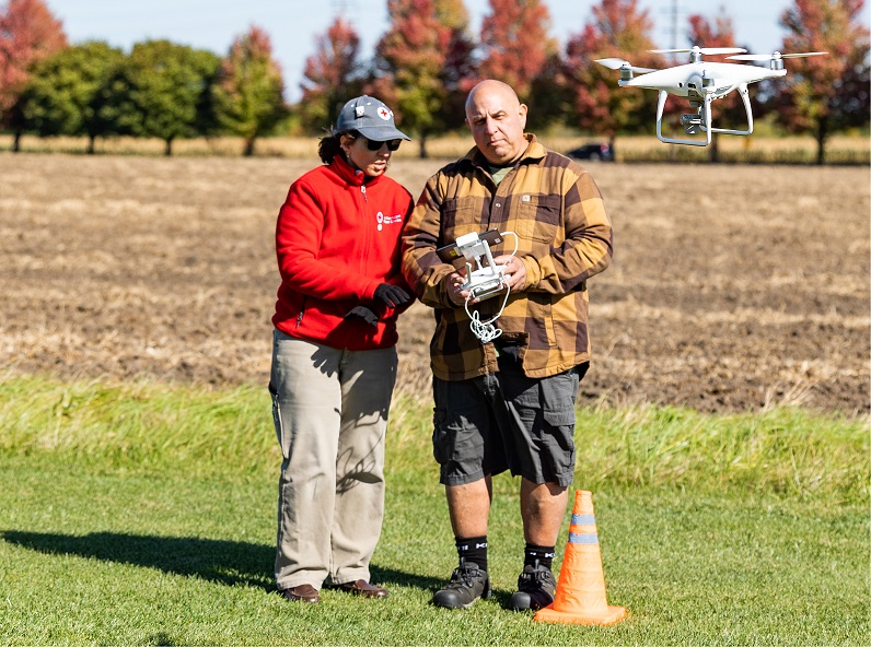 student flying a drone