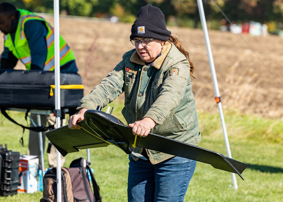 student flying a drone