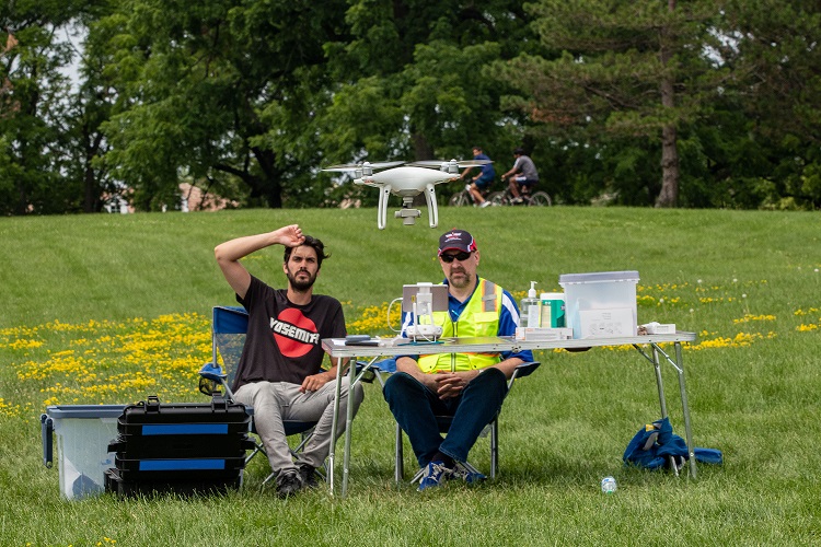 student flying a drone